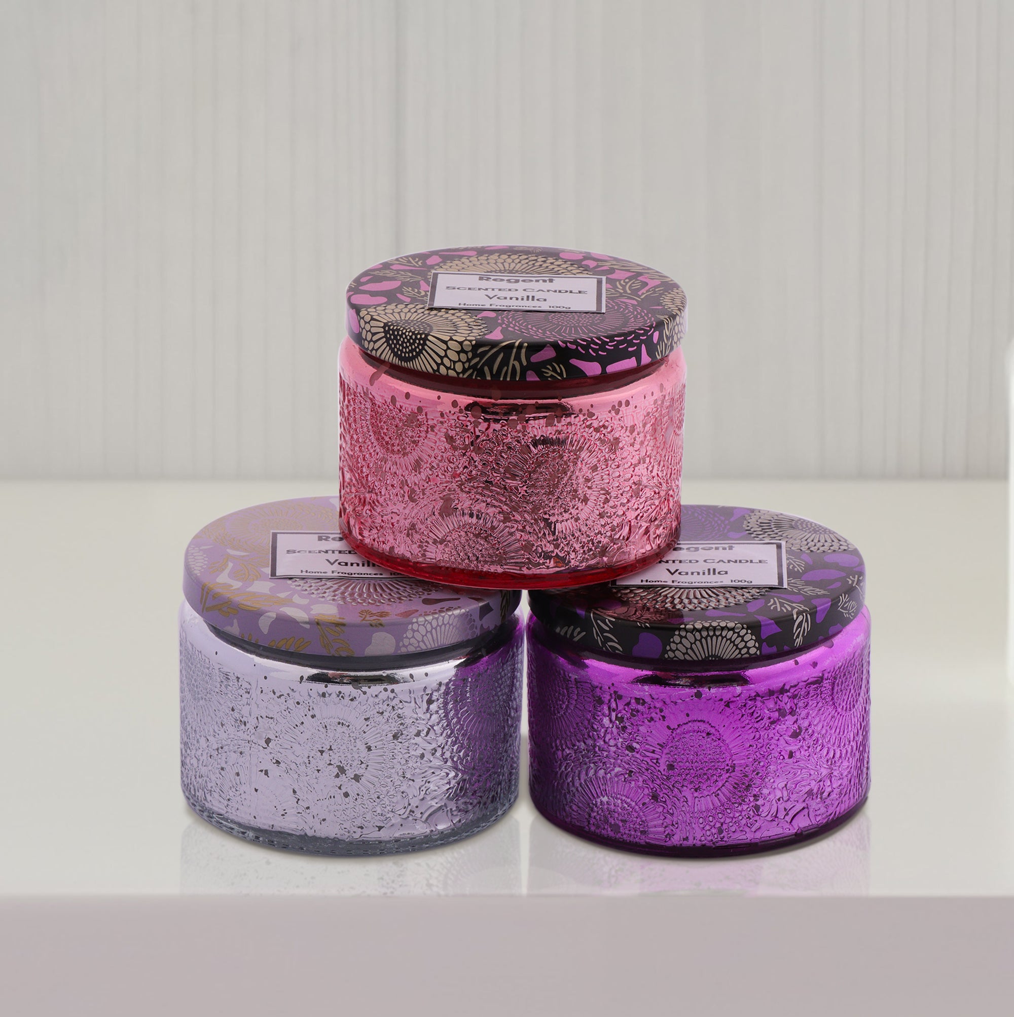 REGENT SCENTED CANDLES VANILLA IN EMBOSSED GLASS JARS, ASST. COLOURS, 100G
