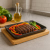 REGENT COOKWARE CAST IRON RECTANGULAR PLATTER ON A WOODEN BOARD, 235X175MM