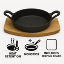 REGENT COOKWARE CAST IRON PAN WITH 2 HANDLES ON A WOODEN BOARD, (250X180X79MM)