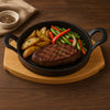 REGENT COOKWARE CAST IRON PAN WITH 2 HANDLES ON A WOODEN BOARD, (250X180X79MM)