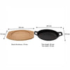 REGENT COOKWARE CAST IRON OVAL PAN WITH 2 HANDLES ON A WOODEN BOARD, 225X120MM