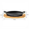REGENT COOKWARE CAST IRON OVAL PAN WITH 2 HANDLES ON A WOODEN BOARD, 225X120MM